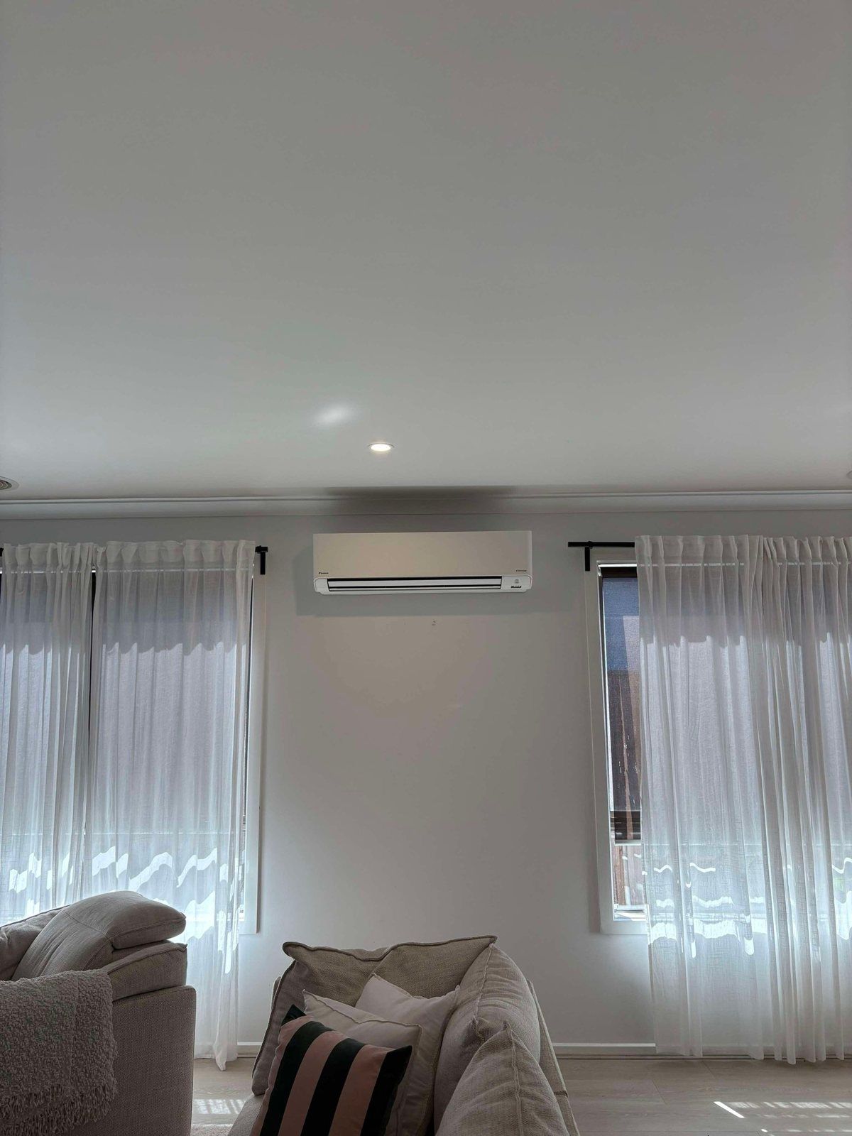 Split system installed above a lounge room window